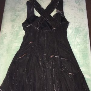 Black dress overlaid with sheer silver shimmer.